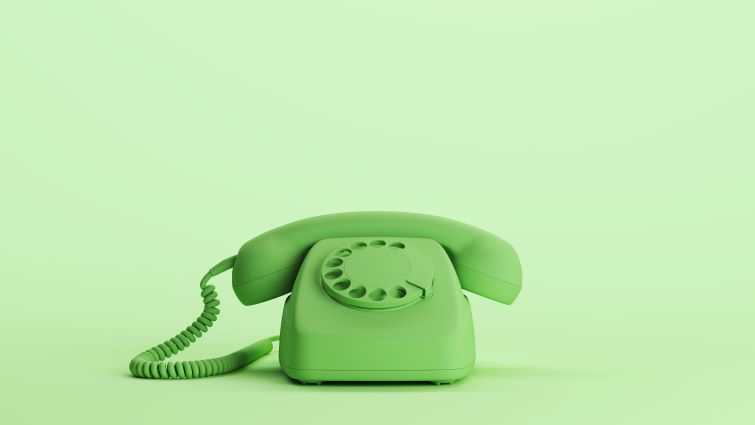 Cold Calling in Recruitment - a green telephone sitting on a table, waiting for a call.